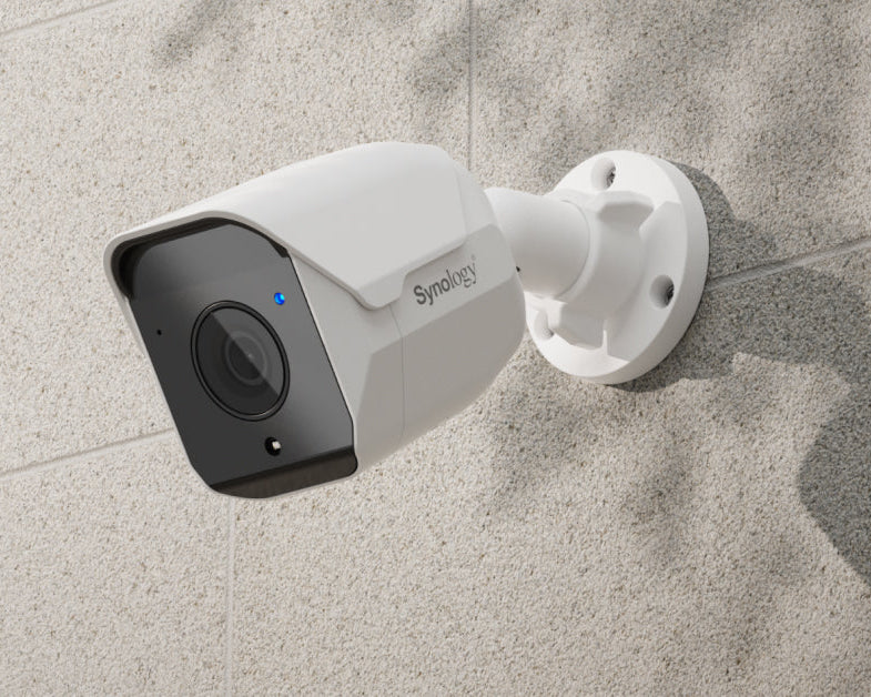 Synology security camera mounted on a wall